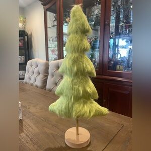 Grinch themed furry stand up tree. It measures 
10 X 18 X 4. Please see photos